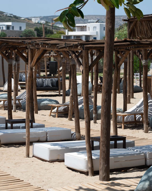 Wooden cabanas on golden sand, SeaRocks beach club