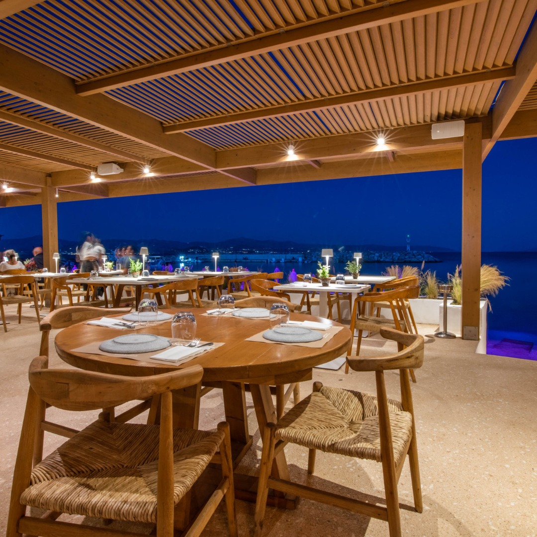 Evening dining terrace at SeaRocks Paros with blue-hour sea view